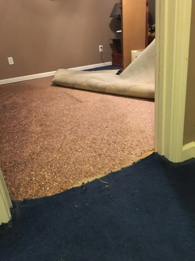 Carpet pad removal revealing water damage during Drying & Dehumidification in Central Point